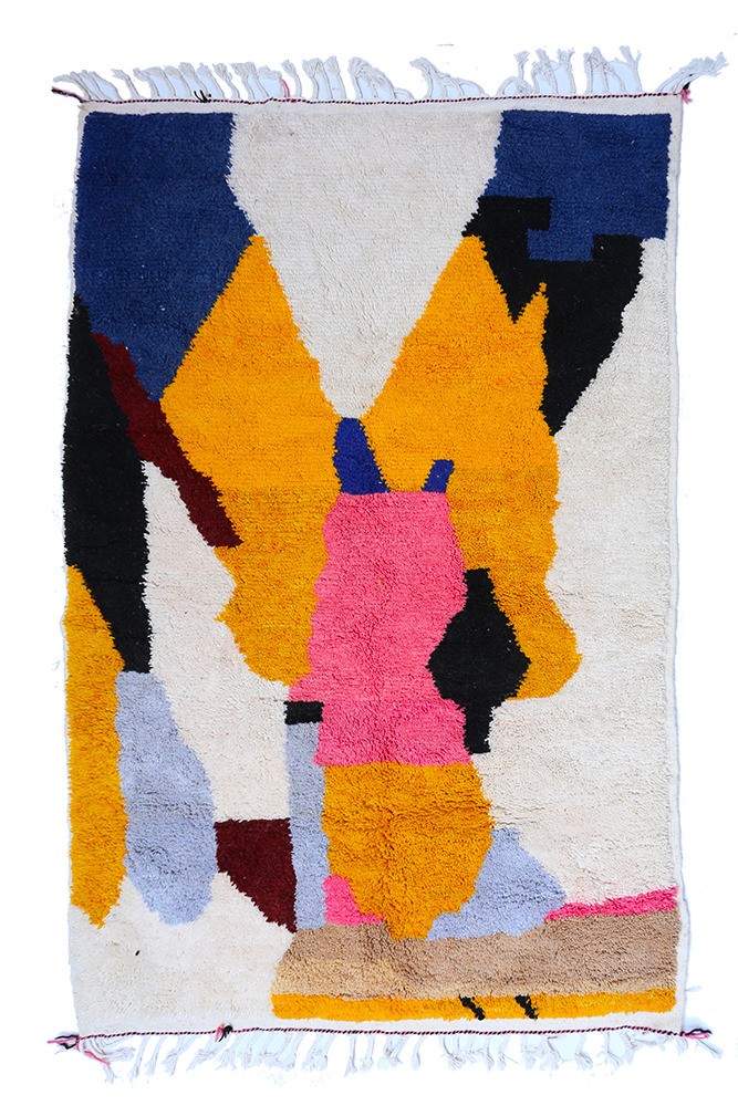 Large modern Berber Azilal rug in brown, yellow, blue, grey, and pink.