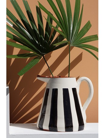 Handmade black and white striped ceramic pitcher from Portugal.
