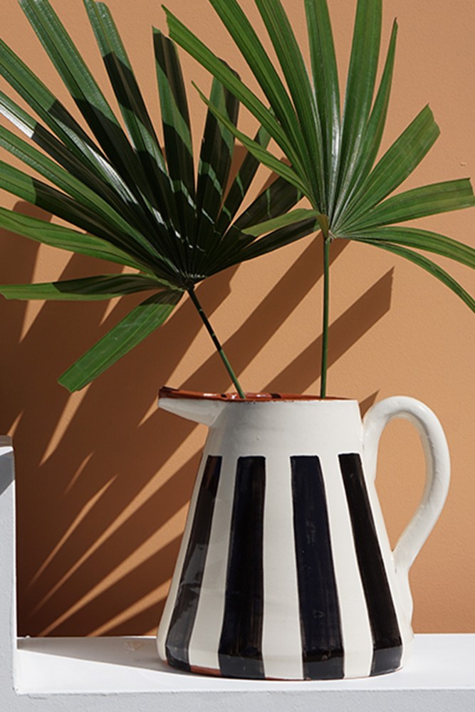 Handmade black and white striped ceramic pitcher from Portugal.