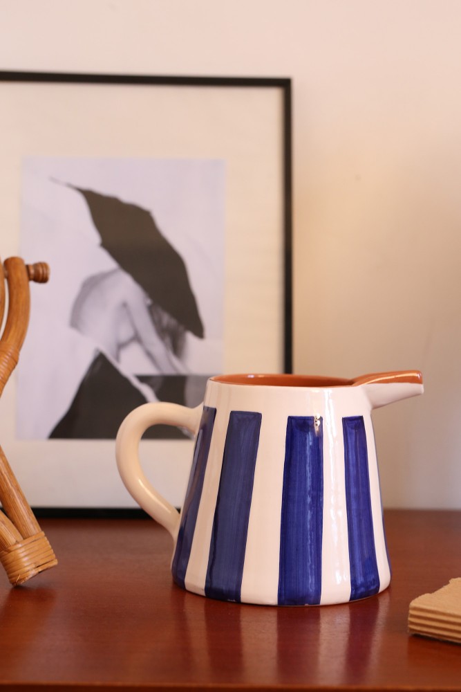 Handcrafted white and blue striped ceramic pitcher made in Portugal.