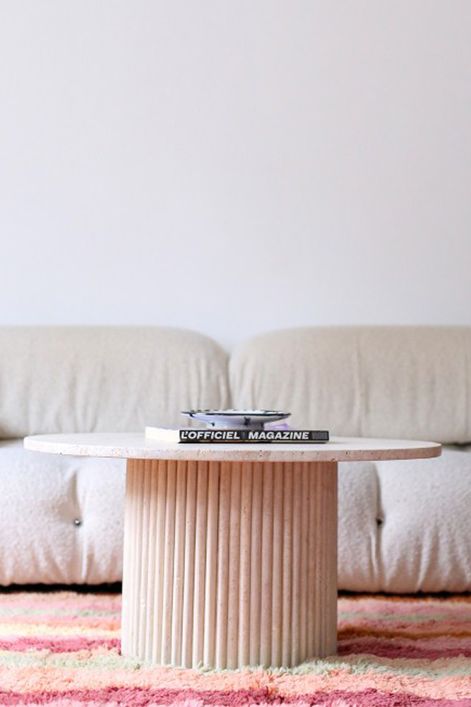 Handcrafted beige travertine coffee table made in Morocco, with an 80cm tabletop and a round pedestal with stripes.