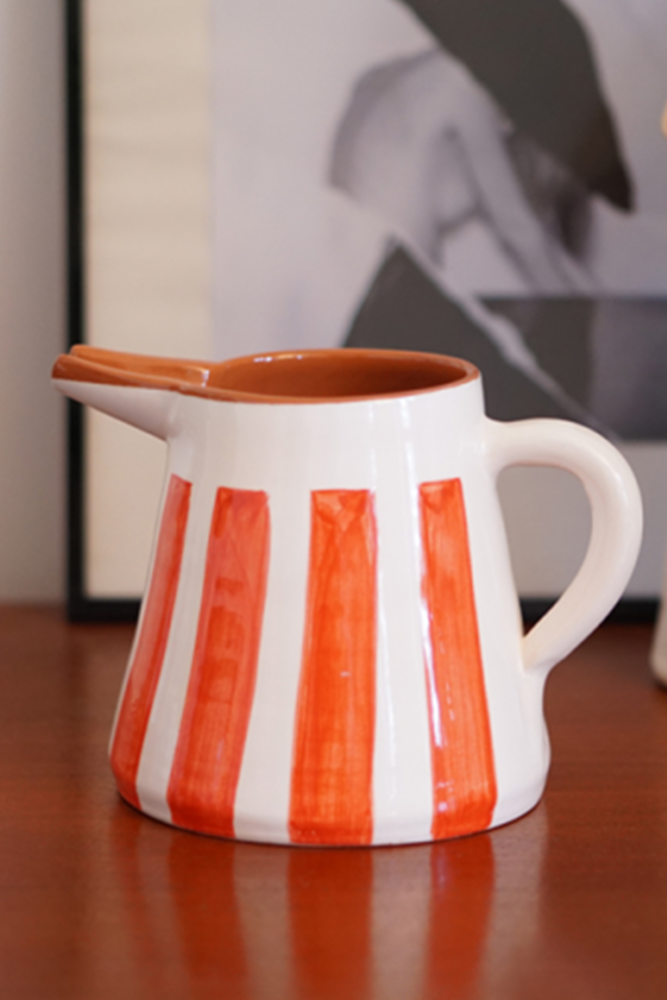Decorative orange ceramic pitcher. Portugal.