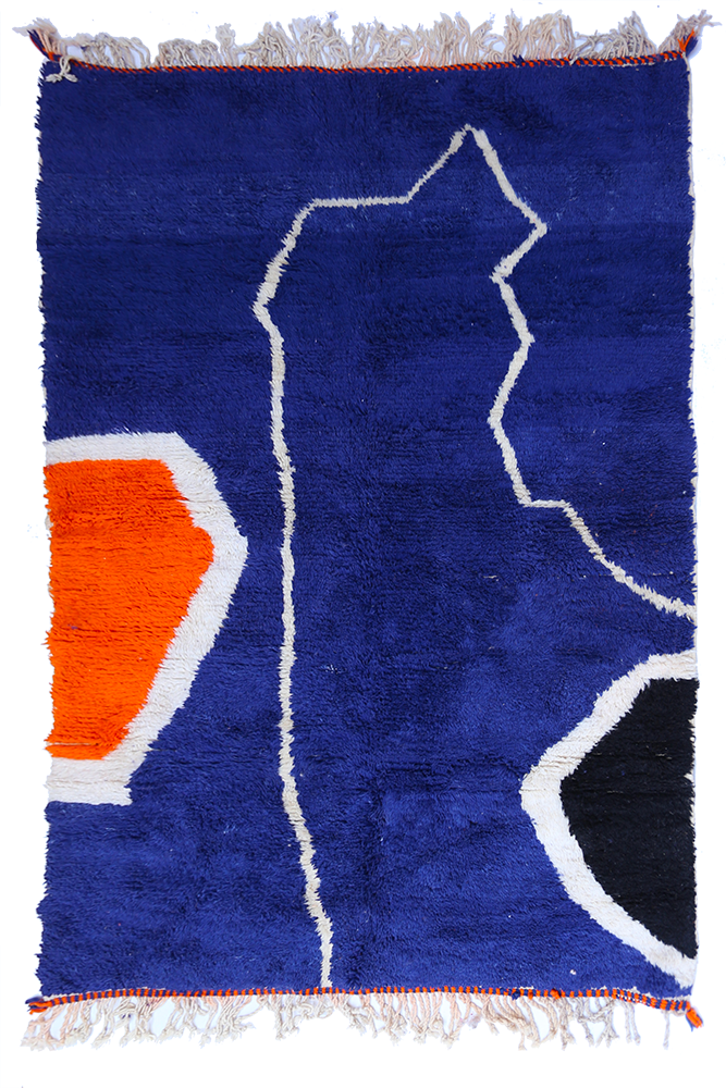 Modern Azilal Berber rug in blue with blocks of black, terracotta, and white colors.
